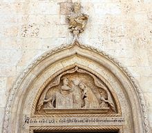 Lunetta del portale della collegiata, recante data 1470, con iconografia dell'incoronazione della Vergine da parte di Cristo