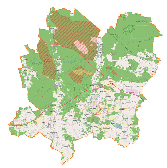 Mapa konturowa powiatu bolesławieckiego, blisko centrum na dole znajduje się punkt z opisem „Bazylika Wniebowzięcia Najświętszej Maryi Panny i św. Mikołaja”