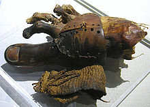 This wood and leather prosthetic toe was used by an amputee to facilitate walking Prosthetic toe.jpg