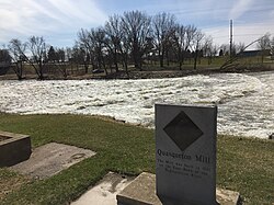 Rapids on the Wapsipinicon River with old mill monument at Quasqueton