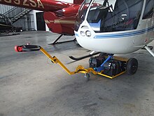 Robinson Helicopter Tow Cart Connected to R66 Robbie Tug Tow Cart R66.jpg