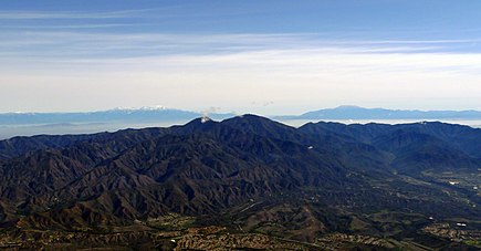 An aerial view of Santiago and Modjeska peaks of Saddleback from the west, looking eastward toward the San Jacinto Mountains and beyond Santiago Peak and Modjeska Peak Saddleback photo D Ramey Logan.jpg