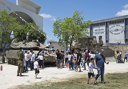 Families celebrating in Israel Defense Force fair in Sderot, 2019.