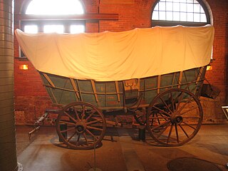 A Conestoga wagon, a type of freight wagon used extensively in the United States and Canada in the 18th and 19th centuries for long-distance hauling