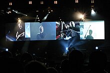 Coldplay performing "Talk" during their 2005 Twisted Logic Tour Talk (Kansas, 2005).jpg