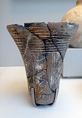 Tasian beaker, found in a Badarian grave at Qau; tomb 569, around 4000 BC; Upper Egypt; British Museum Tasian vessel.jpg