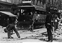 A constable overlooks construction for streetcar lines on Adelaide and Yonge Street, 1911. Toronto Railway Co. streetcar, Yonge and Adelaide streets.jpg