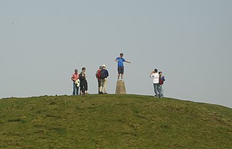 People standing near trig point