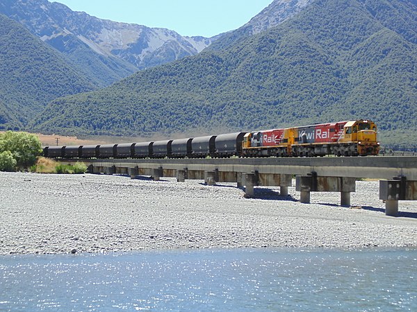 Two DXC locomotives on a coal train from Ngakawau to Lyttelton crossing the Waimakariri River bridge