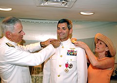Vice Adm. James M. Zortman is pinned with his new rank by his wife and Adm. William J. Fallon, commander, U.S. Fleet Forces Command on July 28, 2004.