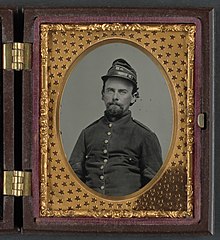 Unidentified soldier in Confederate uniform and Richmond Howitzers artillery unit hat Unidentified soldier in Confederate uniform and Richmond Howitzers artillery unit hat LCCN2011647963.jpg