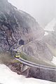 English: (missing text) A railcar just left tunnel No. 5 on the last section before reaching the summit. Behind Tunnel 5 a shelter protects the trackbed against rockfall. Deutsch: (missing text) Ein Triebwagen auf Bergfahrt verläßt Tunnel Nr. 5 auf dem letzten Abschnitt unterhalb des Gipfels. Im Anschluss an den Tunnel schützt eine Galerie die Bahntrasse gegen Steinschlag.