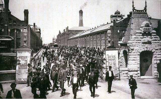 Workers leave the Pullman Palace Car Works in 1893