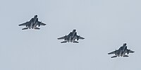 A formation of three F-15C/D Eagles overhead Kadena Air Base in Okinawa, Japan. The aircraft are assigned to the 18th Wing.