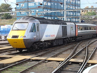 43316, in the silver and white livery of National Express, departs Kings Cross