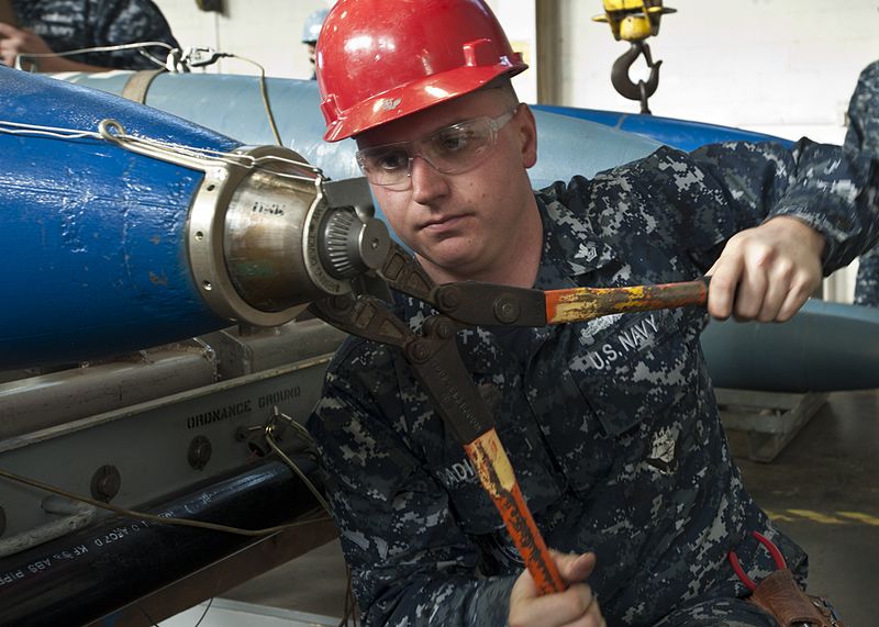 File:A Sailor practices arming a mine. (8408580174).jpg