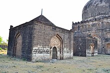 Tombs of Wali-ullah and Kalim-ullah with the tomb of Mahmud Shah in the background Ashtur tombs (19).jpg