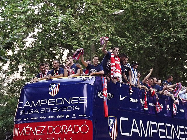 Atlético Madrid celebrates after winning the 2013–14 La Liga. Simeone can be seen in the back of the photo.