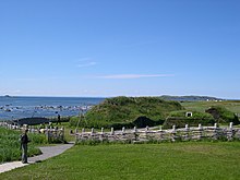 A reconstruction of Norse buildings at the UNESCO listed L'Anse aux Meadows site in Newfoundland, Canada. Archaeological evidence demonstrates that iron working, carpentry, and boat repair were conducted at the site. Authentic Viking recreation.jpg