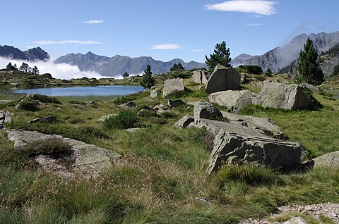 The lake is surrounded by granite boulders and mountain pines.