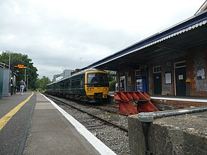 British Rail Class 165 121 in GWR livery Standing at Bourne End Platform 1 with a service to Marlow..jpg