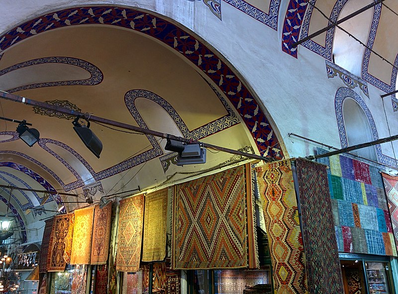 File:Carpets Merchant At The Grand Bazaar (160274103).jpeg