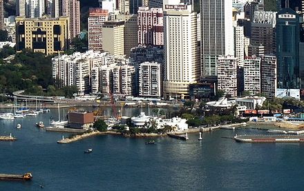 Kellett Island with the Royal Hong Kong Yacht Club buildings in 2011. A portion of the Causeway Bay Typhoon Shelter is visible on the left of the picture.