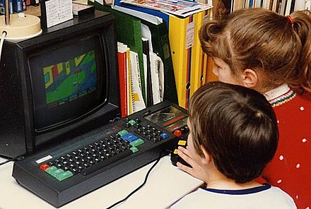Children playing Paperboy on the CPC 464 in 1988