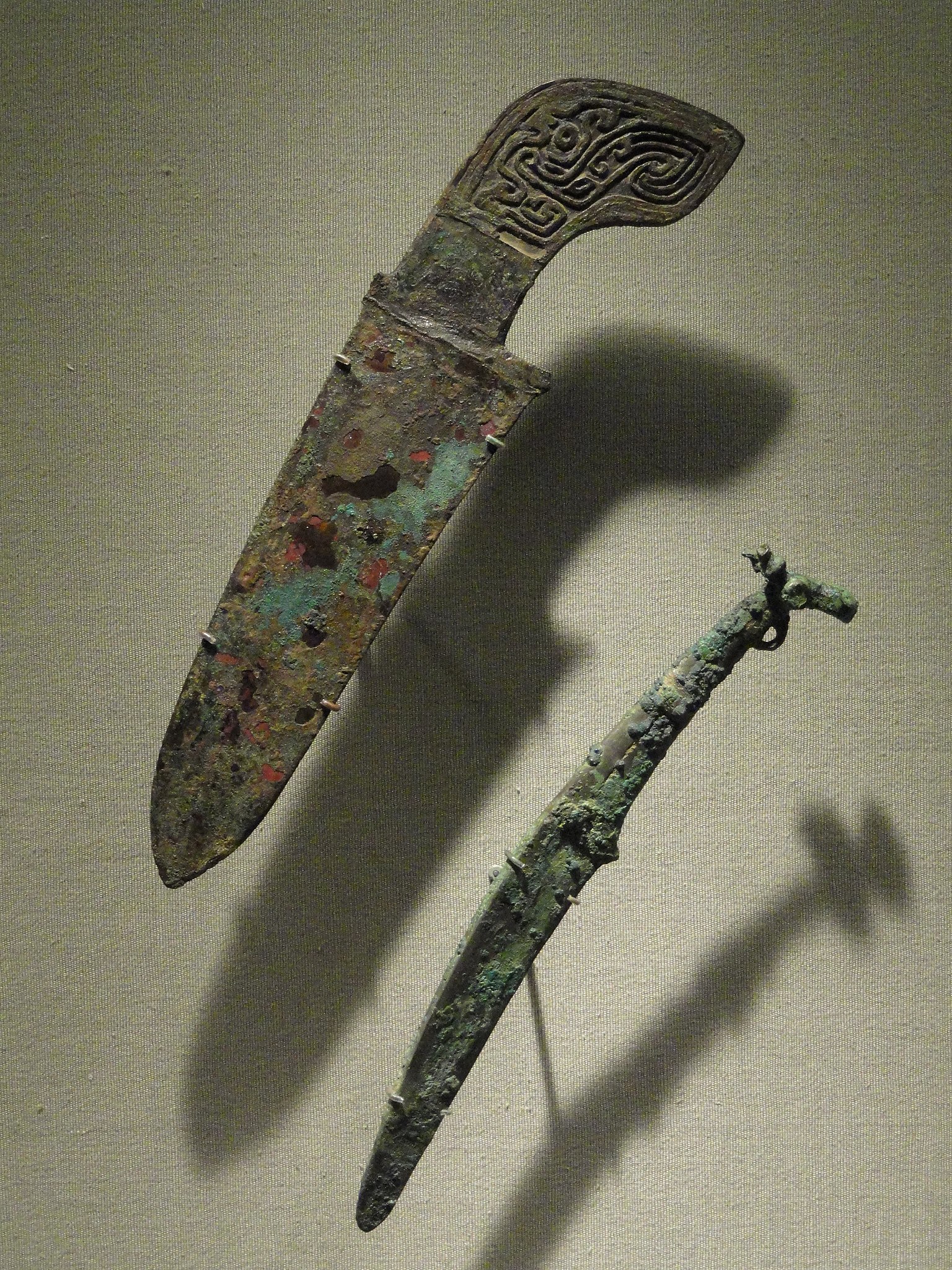 Bronze knives with various heads. Shang Dynasty 11th-12th century