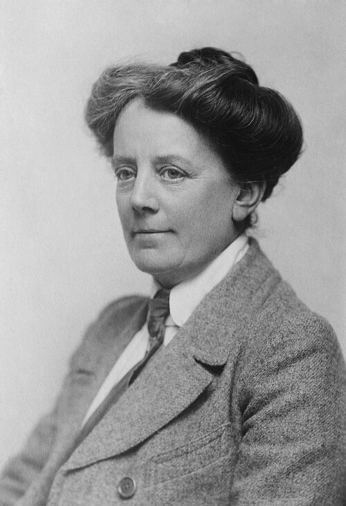 Ethel Smyth (1858–1944) was an English composer and a member of the women's suffrage movement. Her compositions include songs, works for piano, chamber music, orchestral works, choral works and operas. Smyth's extensive body of work includes the Concerto for Violin, Horn and Orchestra, and the Mass in D. Her opera The Wreckers is considered by some critics to be the "most important English opera composed during the period between Purcell and Britten". This photograph of Smyth was taken in 1922.
