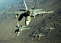 Four U.S. Navy F-A-18 Hornet aircraft fly over mountains in Afghanistan Nov. 25, 2010.jpg