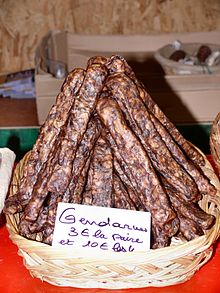 Gendarme ("Policeman"), also known as Landjager, a traditional Alsatian smoked sausage made with beef and pork sold at a Christmas market at Colmar, Haut-Rhin, Alsace, France Gendarmes (saucisses alsaciennes).jpg