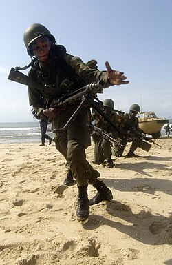 A Ghanaian Army sergeant directs his troops forward Ghanain Army 2005-095.jpg