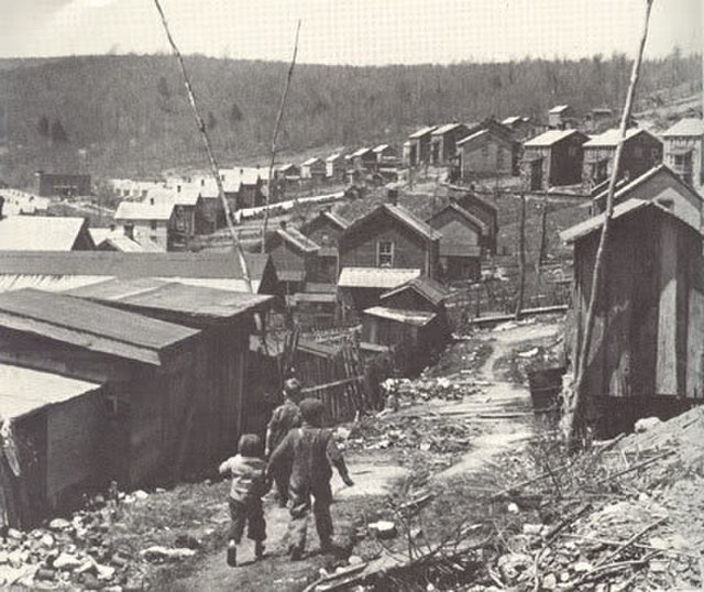 Children walking their way through the town of Evarts
