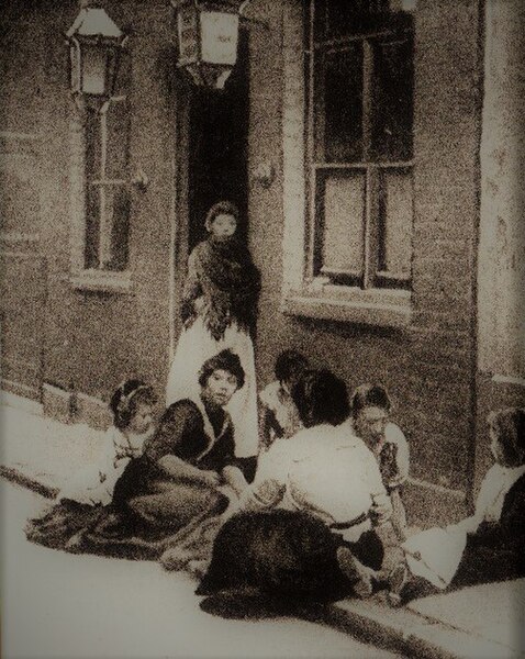 Women and children congregate in front of one of the Whitechapel common lodging-houses close to where Jack the Ripper murdered two of his victims
