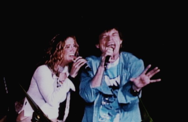 Crow and Mick Jagger on stage during a Rolling Stones concert in 2002