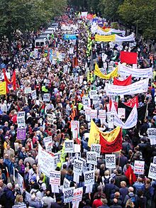 Anti-war protest in London, September 2002. Organized by the British Stop the War Coalition, up to 400,000 took part in the protest. London anti-war protest banners.jpg