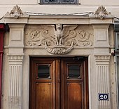 Two pilasters between which is a door, in Lyon (France)