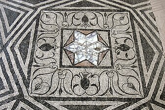 Star-shaped opus sectile inset within a tessellated pavement