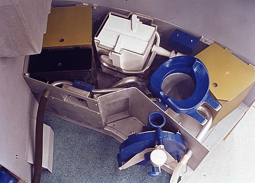 A mockup of the toilet that would be carried on MOL