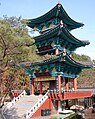 Bell Tower at Manbulsa houses a large brass bell and four smaller bells. The large bell weighs 13 tons and is 12 feet tall. This is the largest bell tower in Korea standing three stories high. Manbulsa (Ten Thousand Buddhas Temple), in the Manbul Mountains, is a Buddhist Temple that has considerably more than Ten Thousand Buddhas represented throughout this new sprawling temple complex.