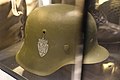 Military helmets of Norway post WW2 (1950s) Norwegian Army (Hæren) helmet of German Stahlhelm type. Coat of arms (riksvåpen) decal. Armed Forces Museum (Forsvarsmuseet) Oslo 2020-02-24 3078.jpg