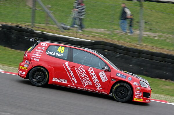 Jackson driving for AmD Tuning.com at Brands Hatch in the 2012 British Touring Car Championship.