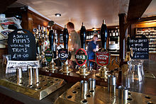Manual beer pumps dispensing British beers from Fuller's Brewery Oxford - The Bear Inn - 0556.jpg