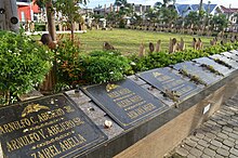 Mass graves of typhoon victims within the Palo Cathedral grounds Palo Cathedral 09.JPG