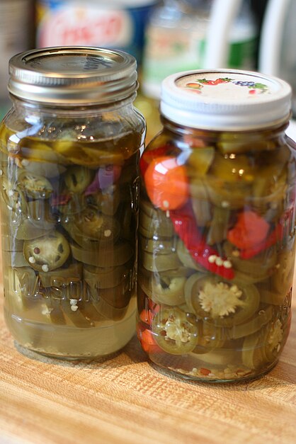 Pickled peppers with vinegar.