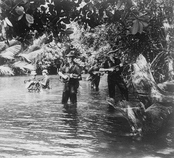 Troops from the Queen's Own Highlanders searching for enemies during a patrol in 1963 during the Indonesia–Malaysia confrontation