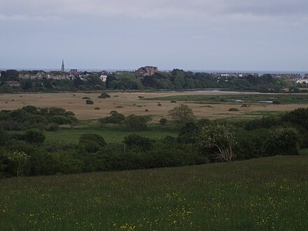 Radipole Lake viewed from Southill. Weymouth town centre can be seen in the distance. Radipole Lake, Weymouth viewed from Southill.jpg