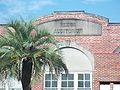 Old Reddick Auditorium, name carved on building, part of the old Reddick High School. At least part of it is being used as an Interfaith thrift store.