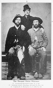 March 17, 1865 photo of three Union soldiers who escaped Confederate Prison Camp including Lieutenant Richard Cooper New Jersey Infantry, Adjudant John J. Hastings 7th Pennsylvania Reserve Infantry, and Captain Rees G. Richards Company G 45th Pennsylvania Infantry. Rees G Richards and other escapees March 17 1865.jpg